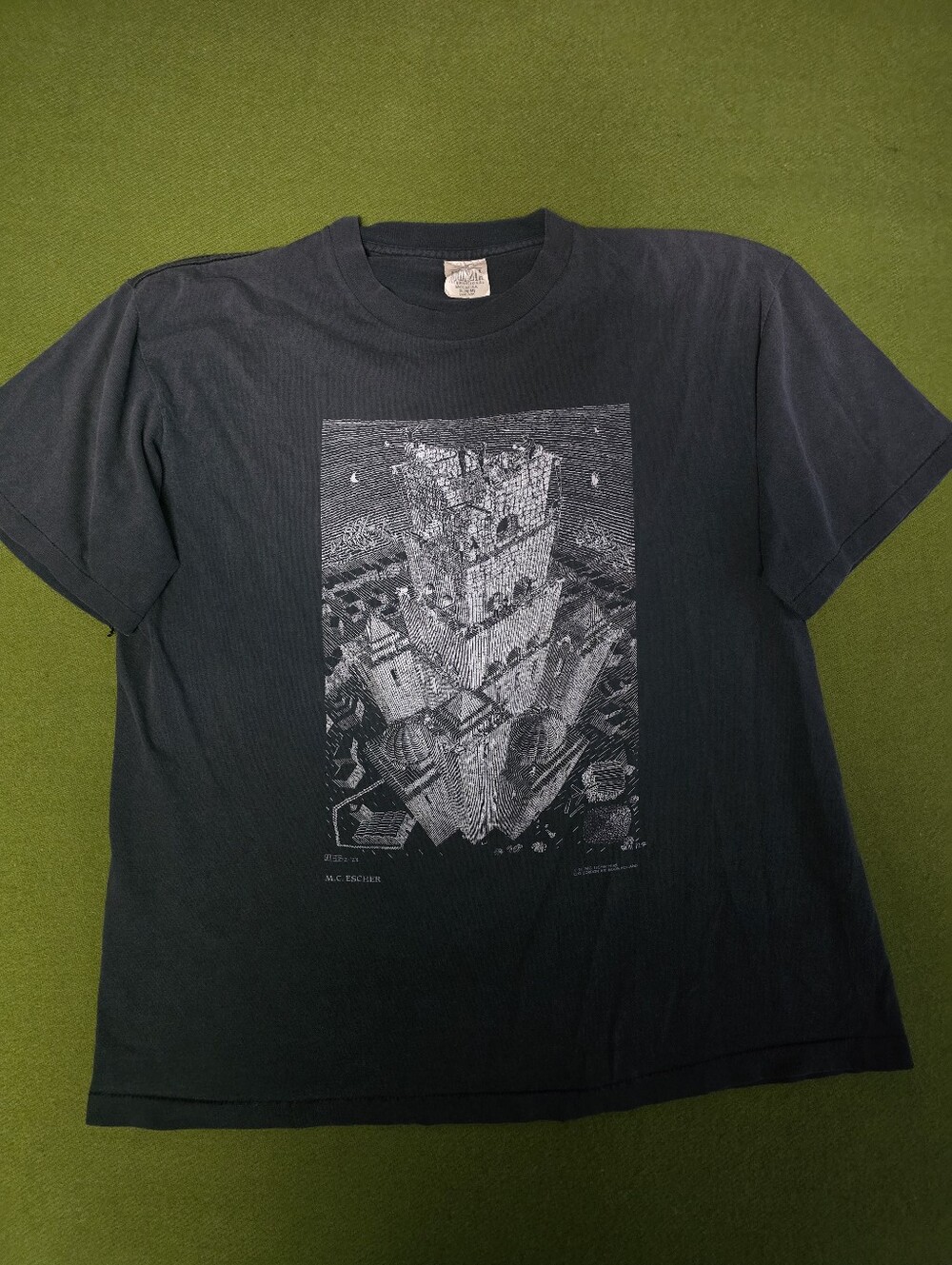 Vintage-style shirt features a large white graphic print of M.C. Escher's